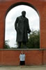 Lucy in front of a statue of Lenin